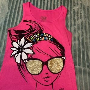 A pink sleeveless top with a black-outlined girl.